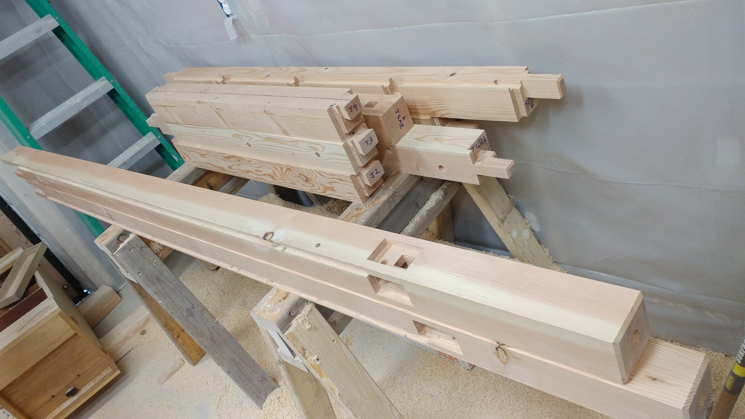 After the joinery is cut and fitted, detail work begins. The parts are given a plane finish. The grain is set alight and the original tree speaks again after some time lying dormant. Assembly begins!