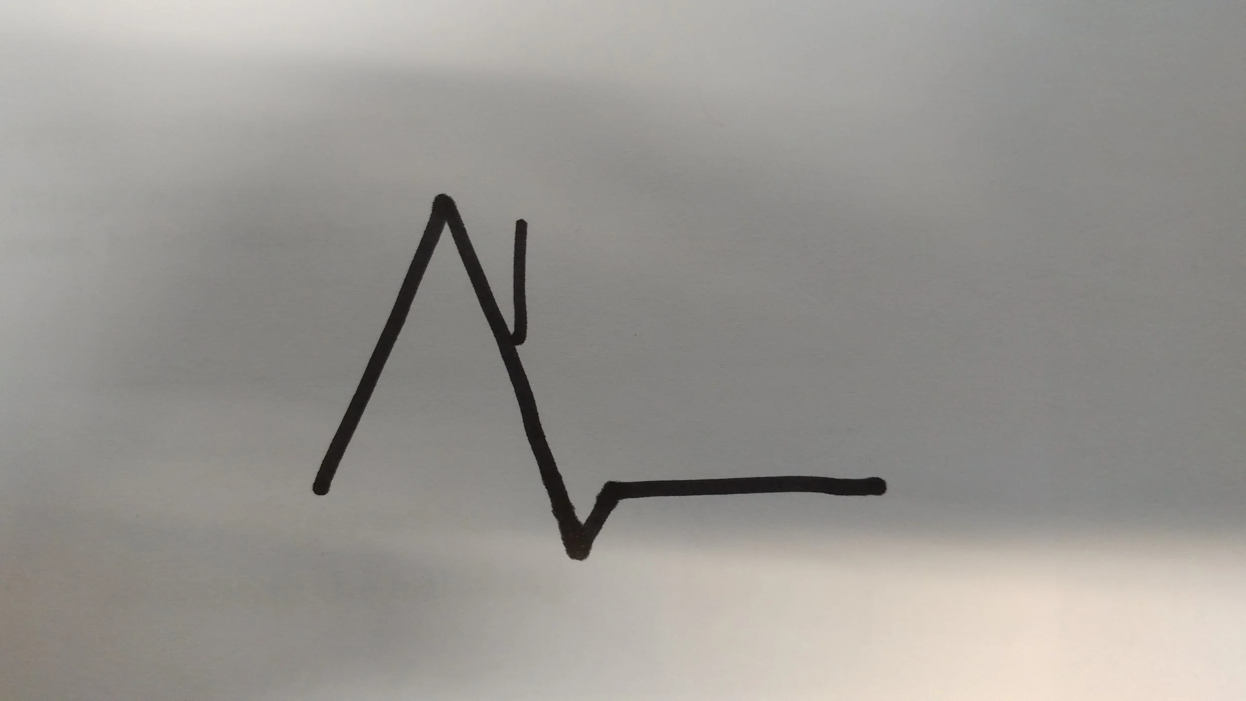 The basic symbol is the same, the line tells you about the tree location. Here it is midway up a mountain or hill.