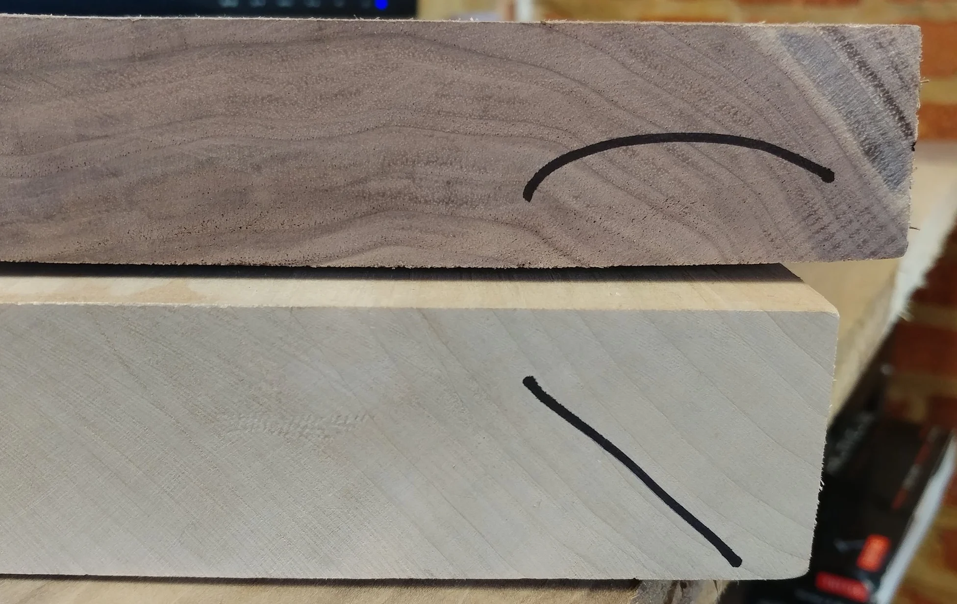 From across the shop it will be easy to see that one board is flat-sawn, and the other rift/quarter. With roughly cut boards, the saw patterns can confuse the grain under end sealant and age. These marks make it quick.