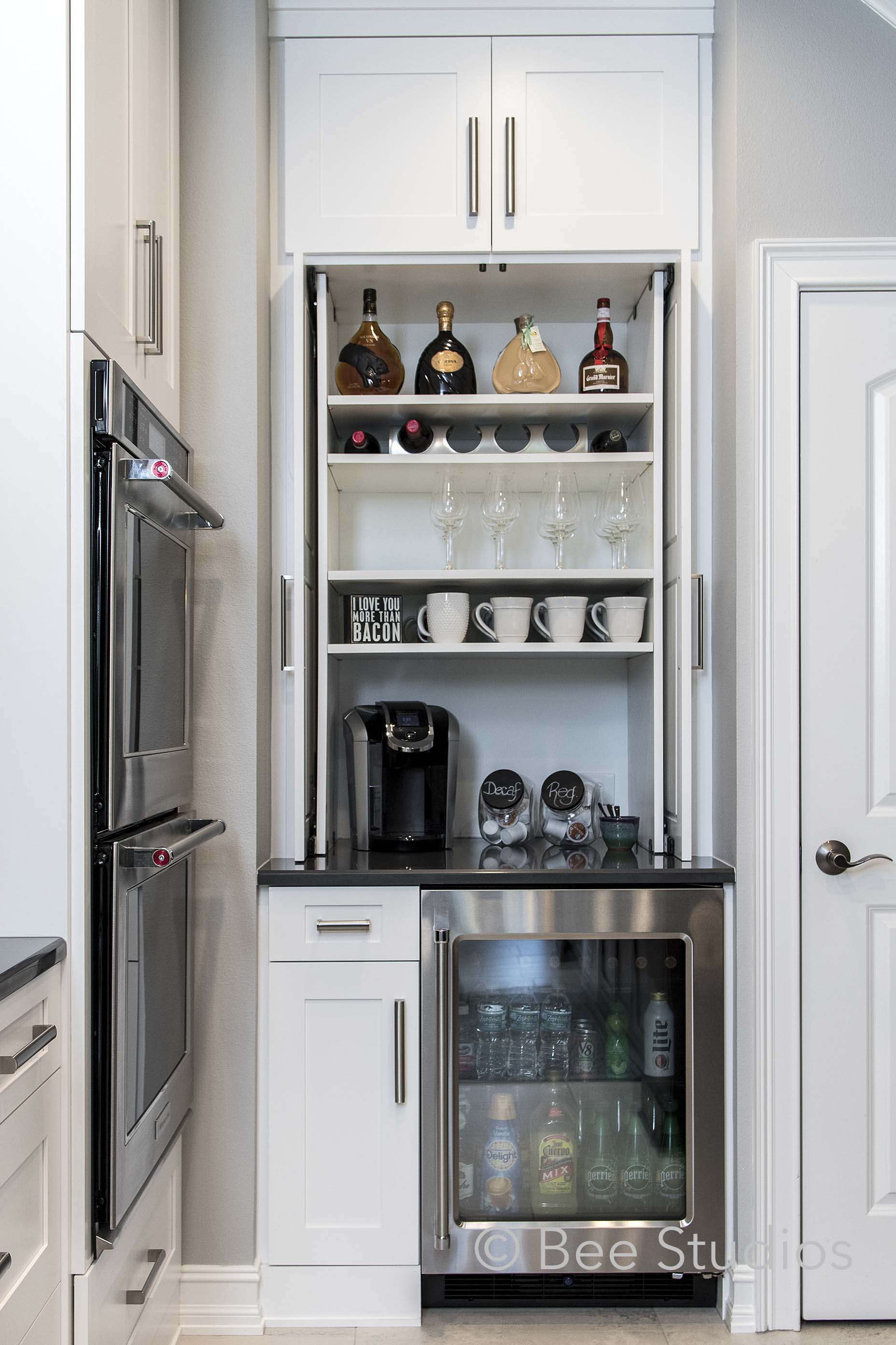 Bar storage in kitchen with wine fridge, bar fridge and coffee station