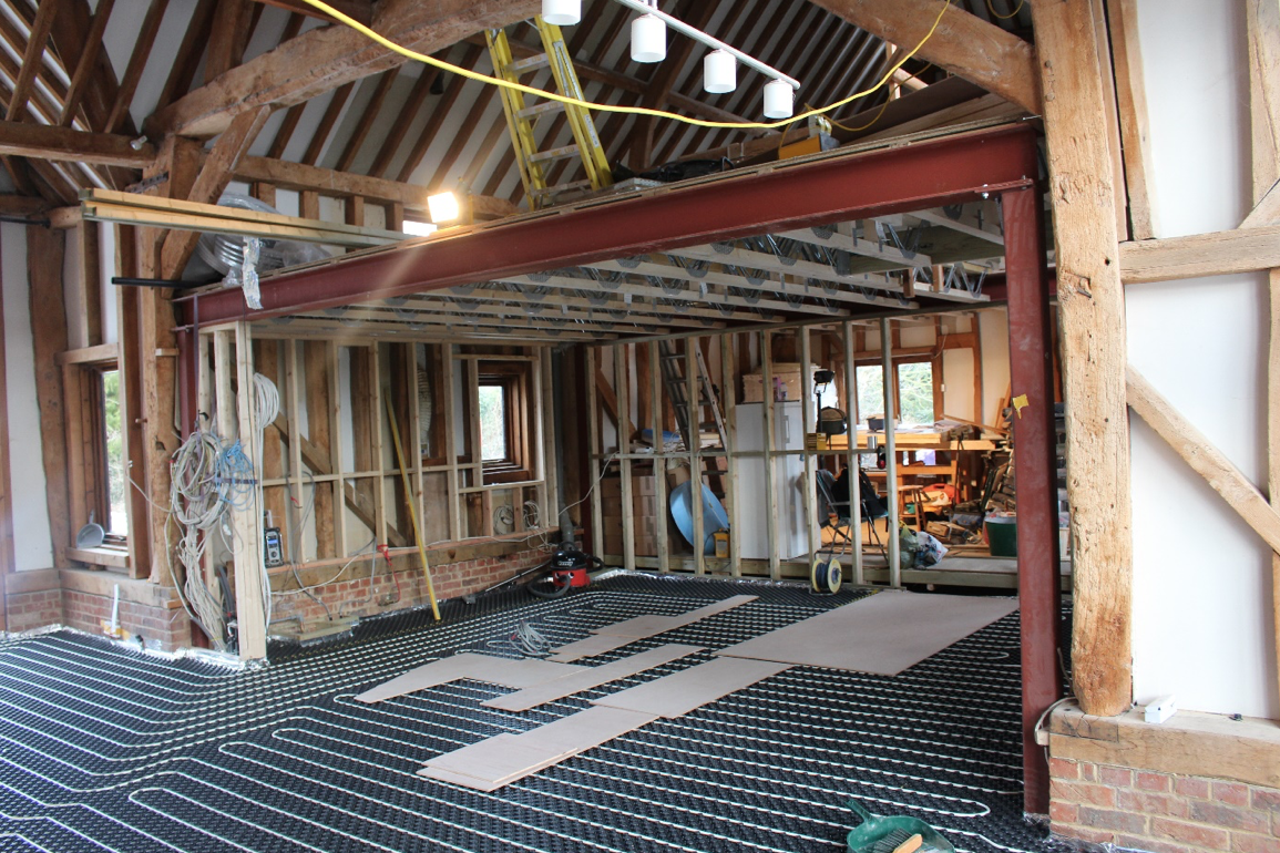 Re-design of the interior of the main barn, removing an existing mezzanine floor and installing a new floor level. Installing new underfloor heating on the ground floor. 
