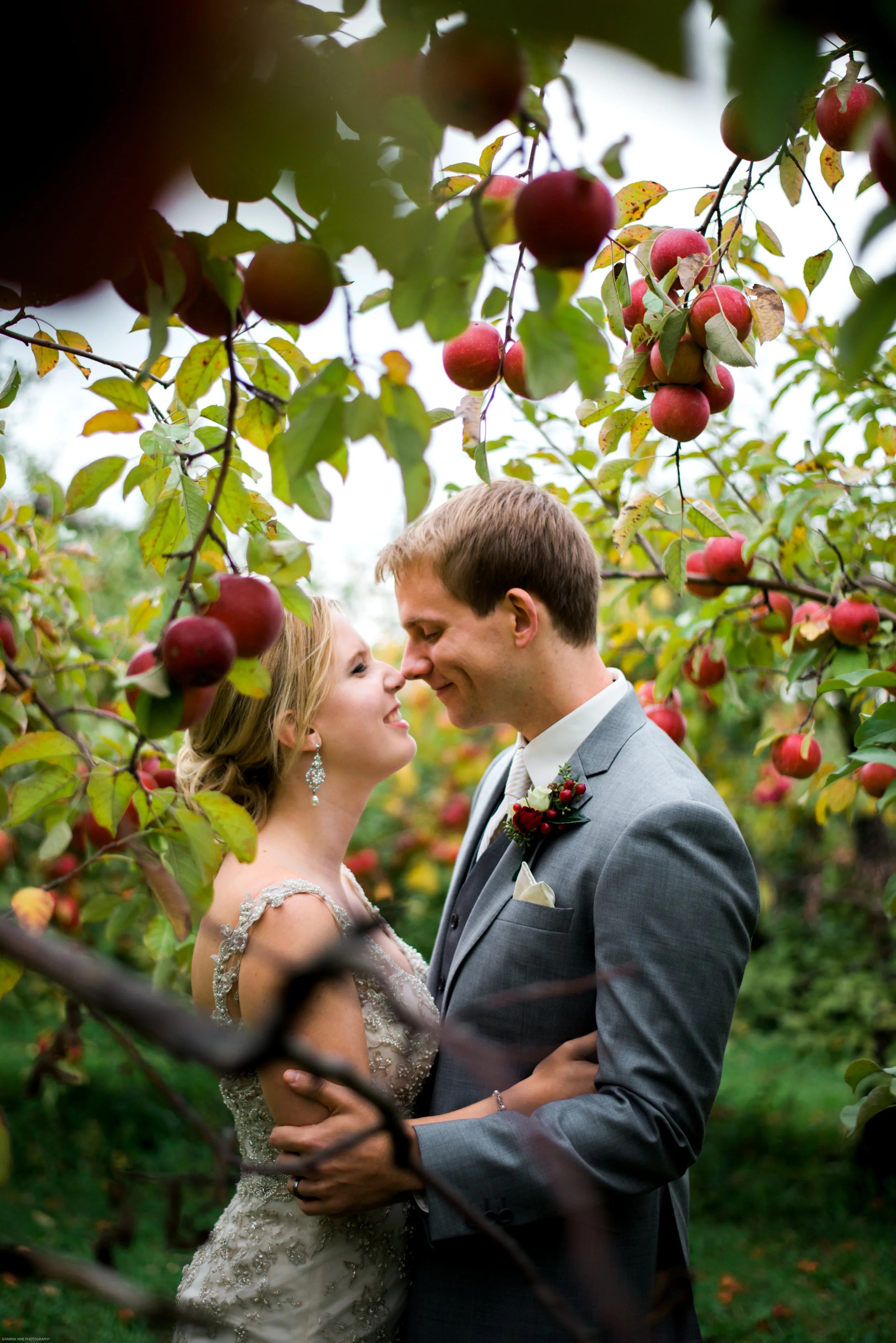 Rachel + Paul "Out of all the decisions we made for our wedding, having Shawna take our photos was by far the best... She was very quick with all the young children I had in my wedding, was very funny and good at putting everyone at ease, and even managed to make the best of our very windy, rainy, and cold orchard wedding. We will definitely turn to her for our family photos in the future. I can not possibly say enough nice things about her talent- and everyone else at the wedding has been giving me compliments about her ever since!"