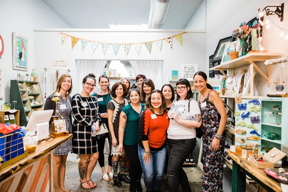 A holiday community event for women entrepreneurs at Strands of Sunshine in 2017. We raised funds for Girls Rock Camp's 2018 camp season and highlighted their mission. Photo by Jessica Fredericks Photography.