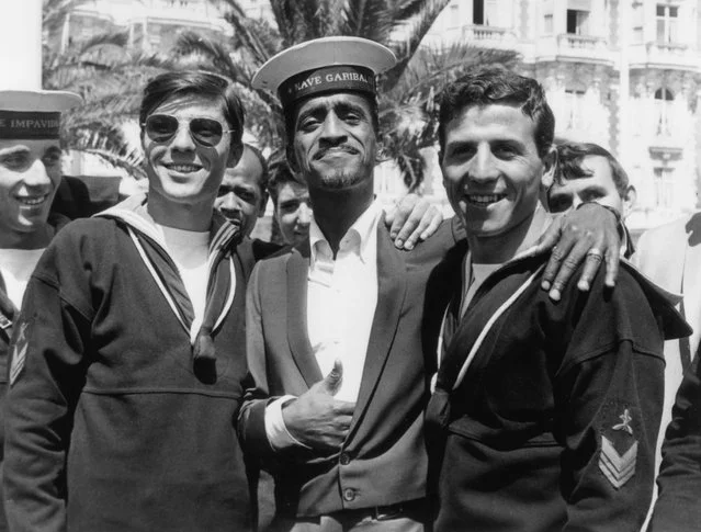 Actor Sammy Davis Jr. poses in a borrowed cap, from a group of Italian sailors, during the Cannes Film Festival, May 5, 1966, in France. Davis was there to promote his film “A Man called Adam”..jpg