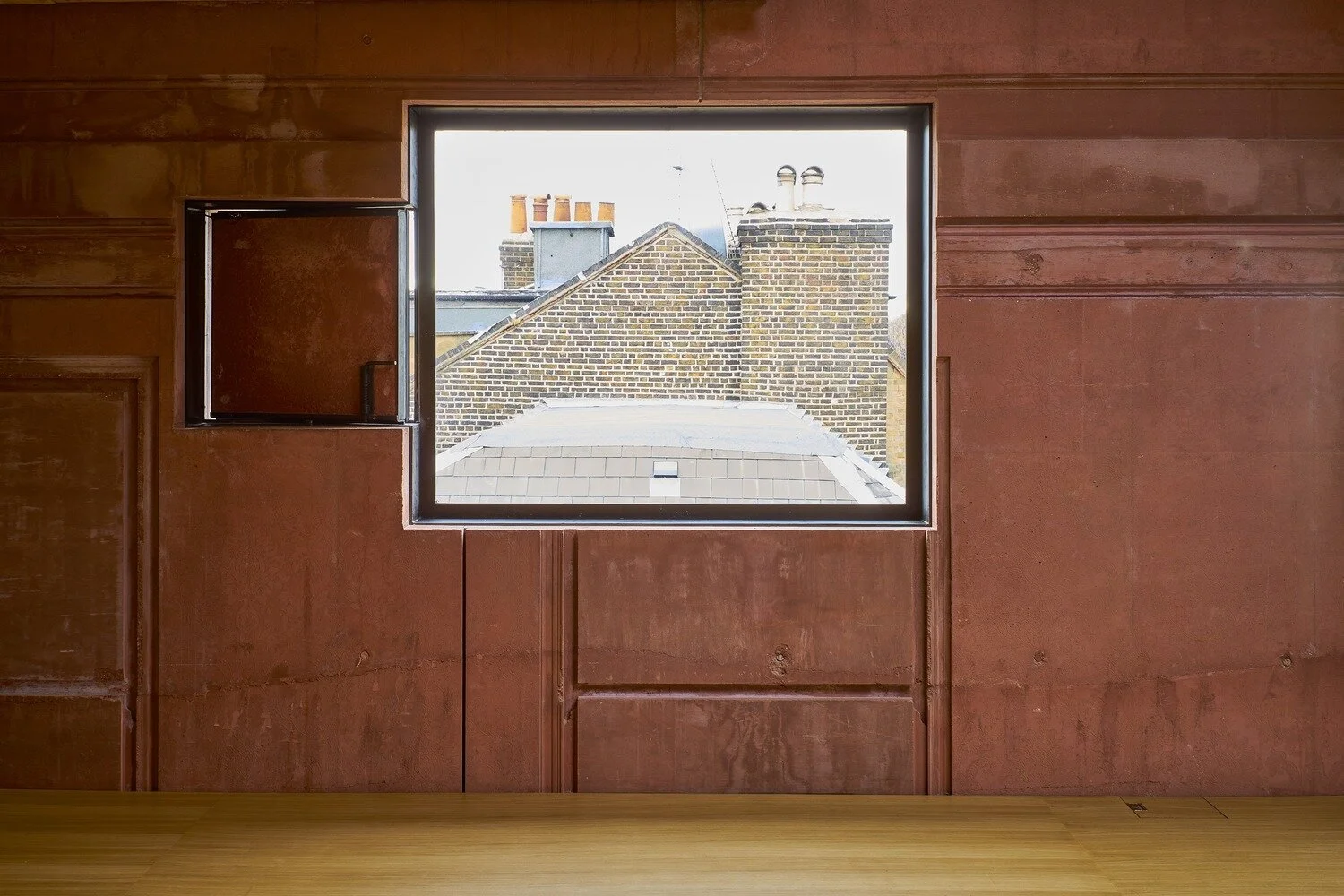 Interior view of window and ventilation panel inserted within the