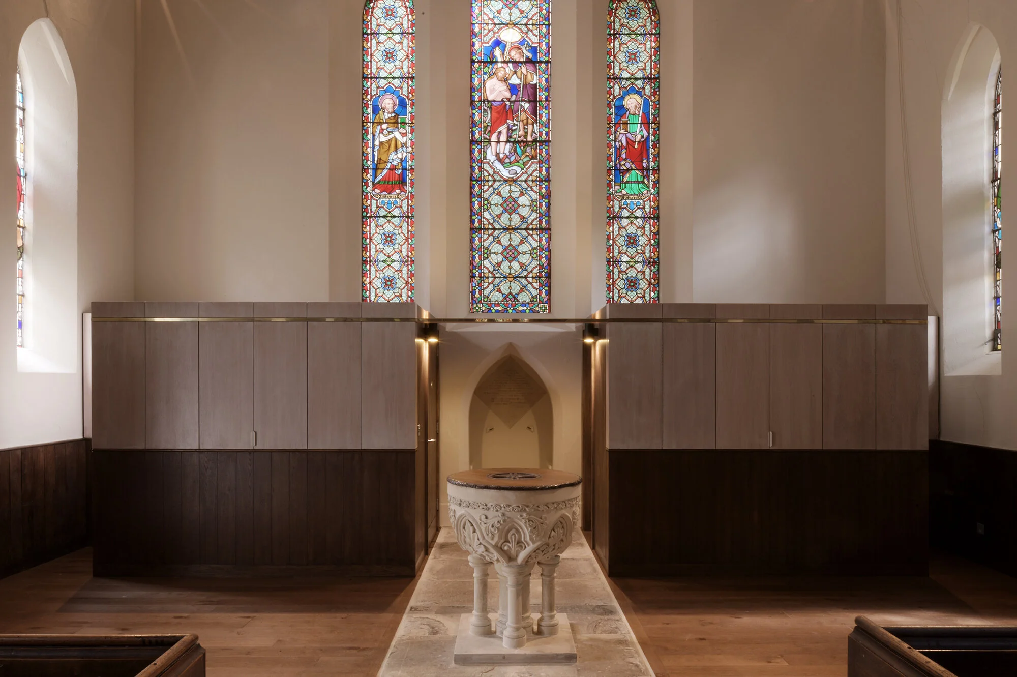 Completion. When closed the cabinets merge with the existing fabric of the church.