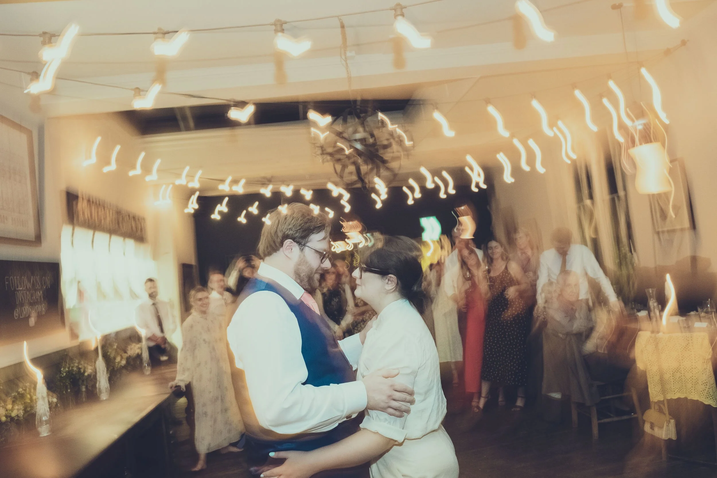 Motion blur photo of wedding couple having first dance in Lordship Pub