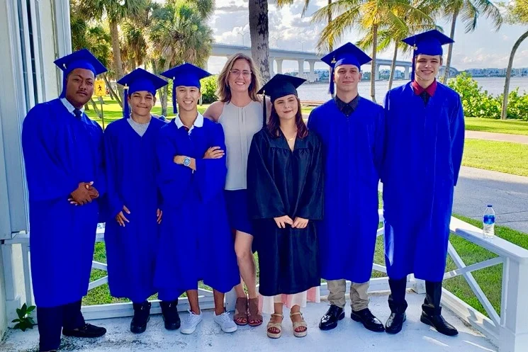 Six of our Palm City Graduates with therapist, Sarah Paulick