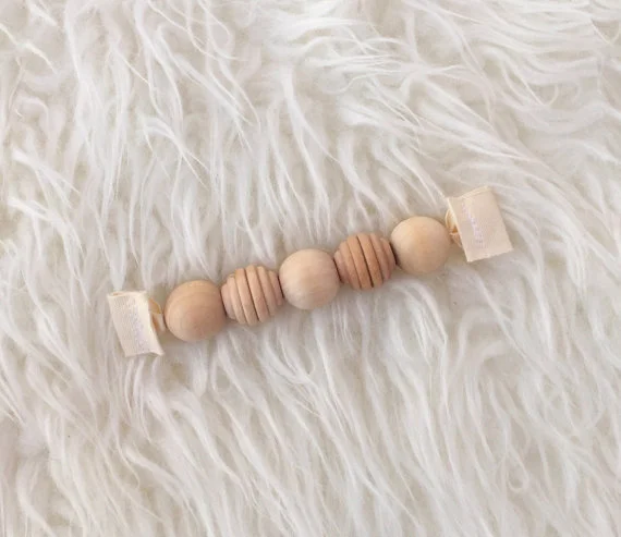 CloverandBirch_grasping_beads.jpg