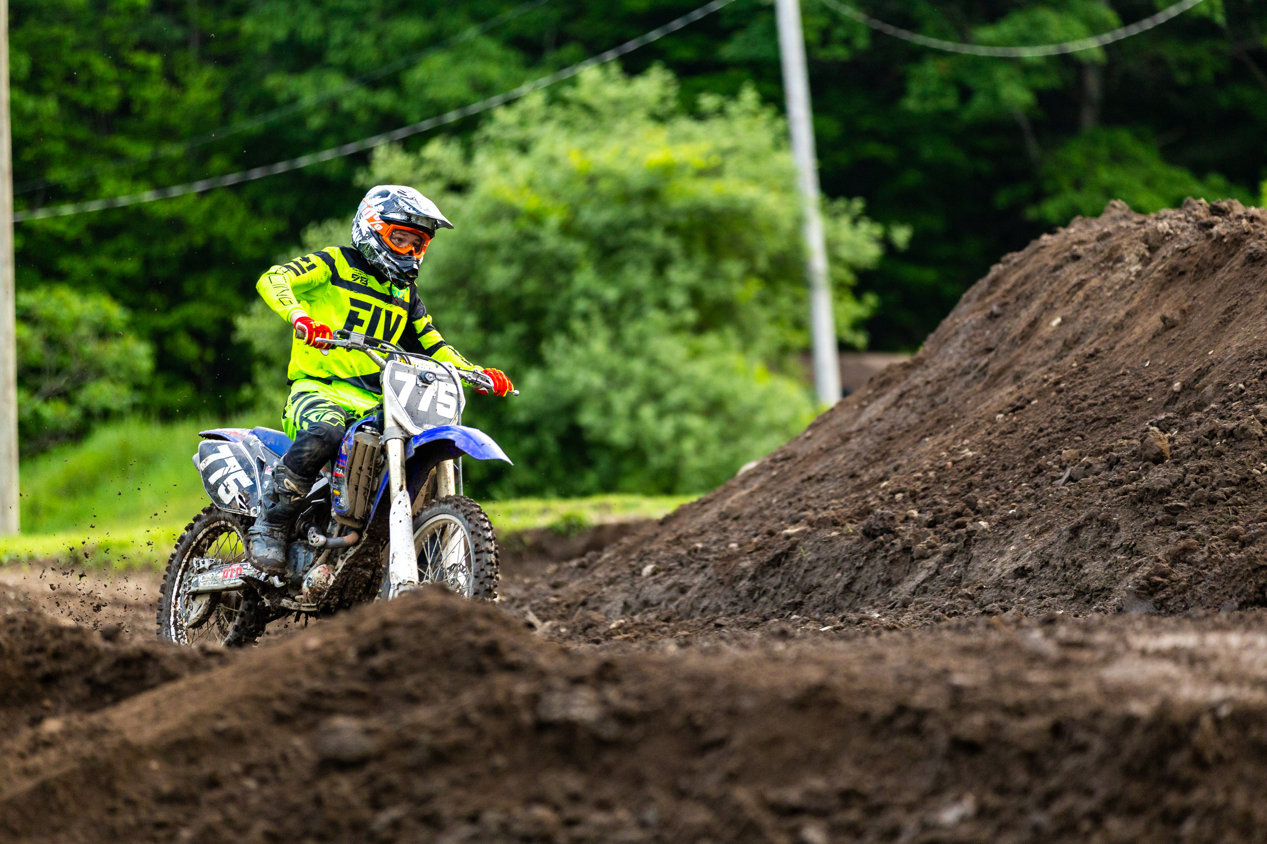 Photo of racer #775 warming up before the first Supercross race on 6/6/18