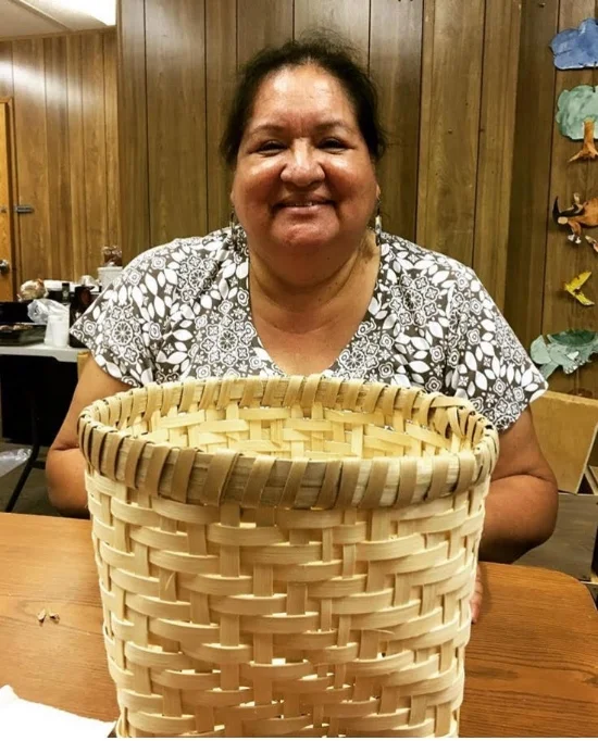 My mom and her corn-washing basket. Used to clean corn after the nixtamalization.