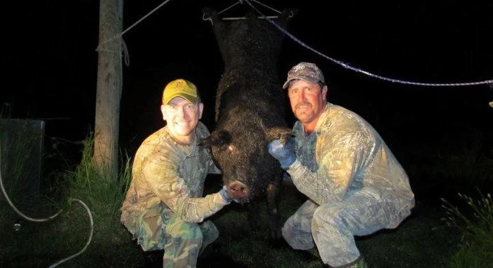 Abell and Greg pig.jpg