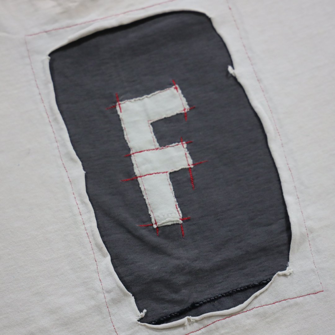 Handmade deconstructed streetwear design known as the Original F Shirt, an early Clothing That Speaks® artwear piece.