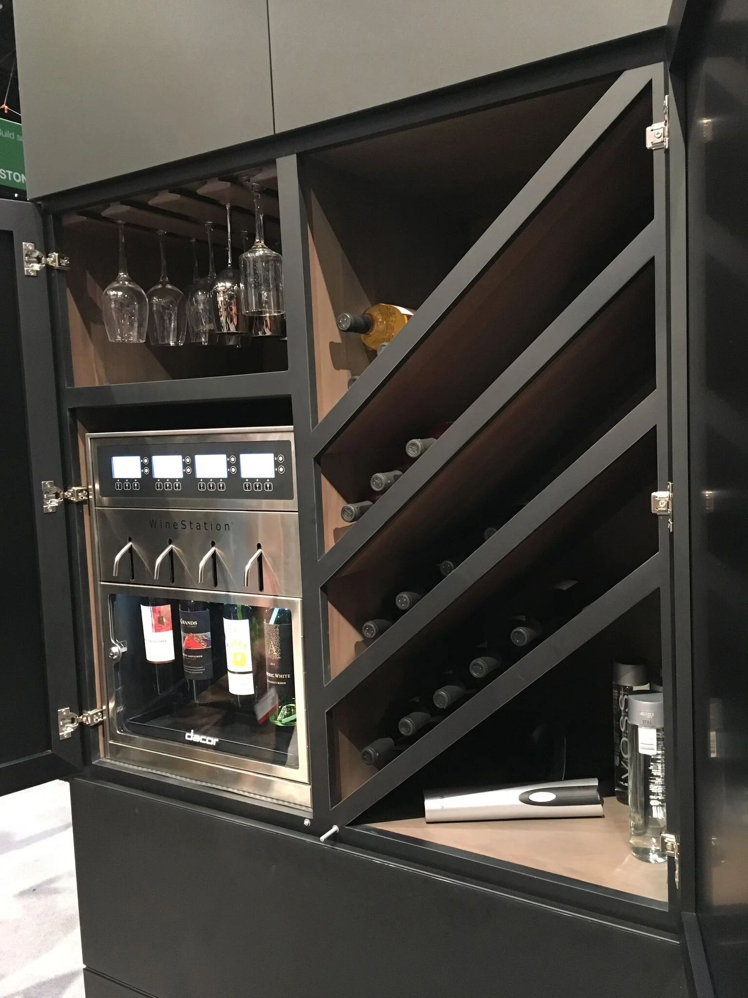 most new kitchen include a wine or beverage refrigerator: The Dacor Discovery system brings this to a completely new level, and this combined custom wine cabinet showcases a new slant on the concept.