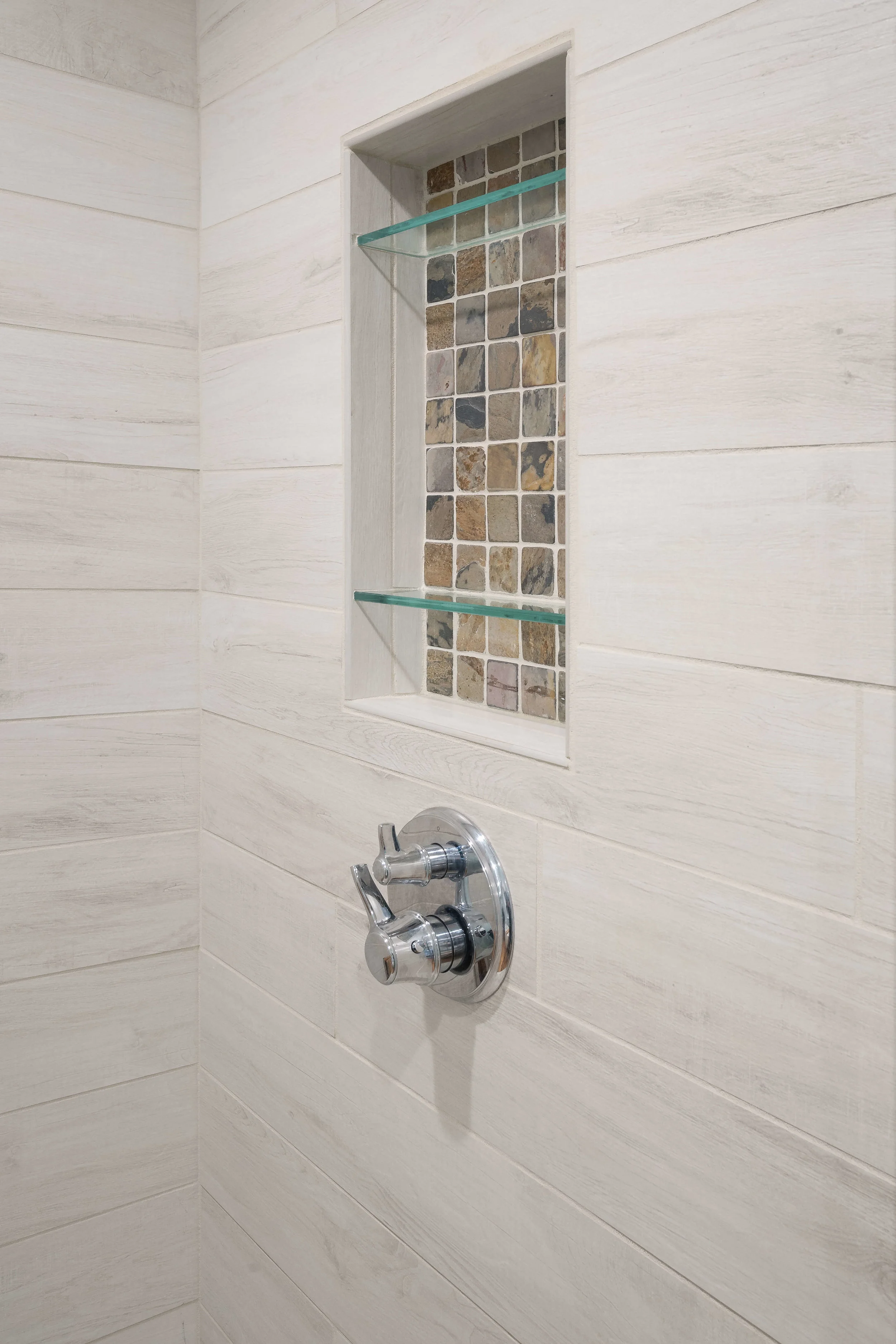 Design detail: Recessed shower niche tile echoes the vanity backsplash.