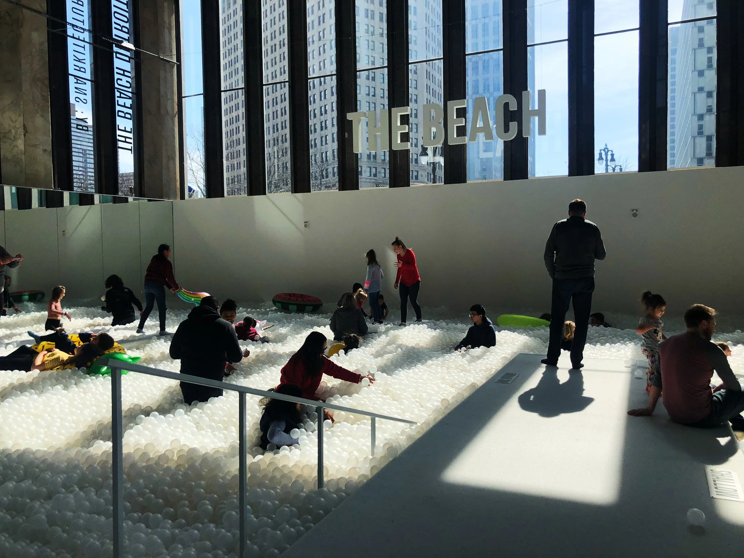  People play among the ball pit at The Beach at 1001 Woodward in downtown Detroit. It is a temporary art installation by New York-based collaborative “Snarkitecture”. // Detroit, Michigan 