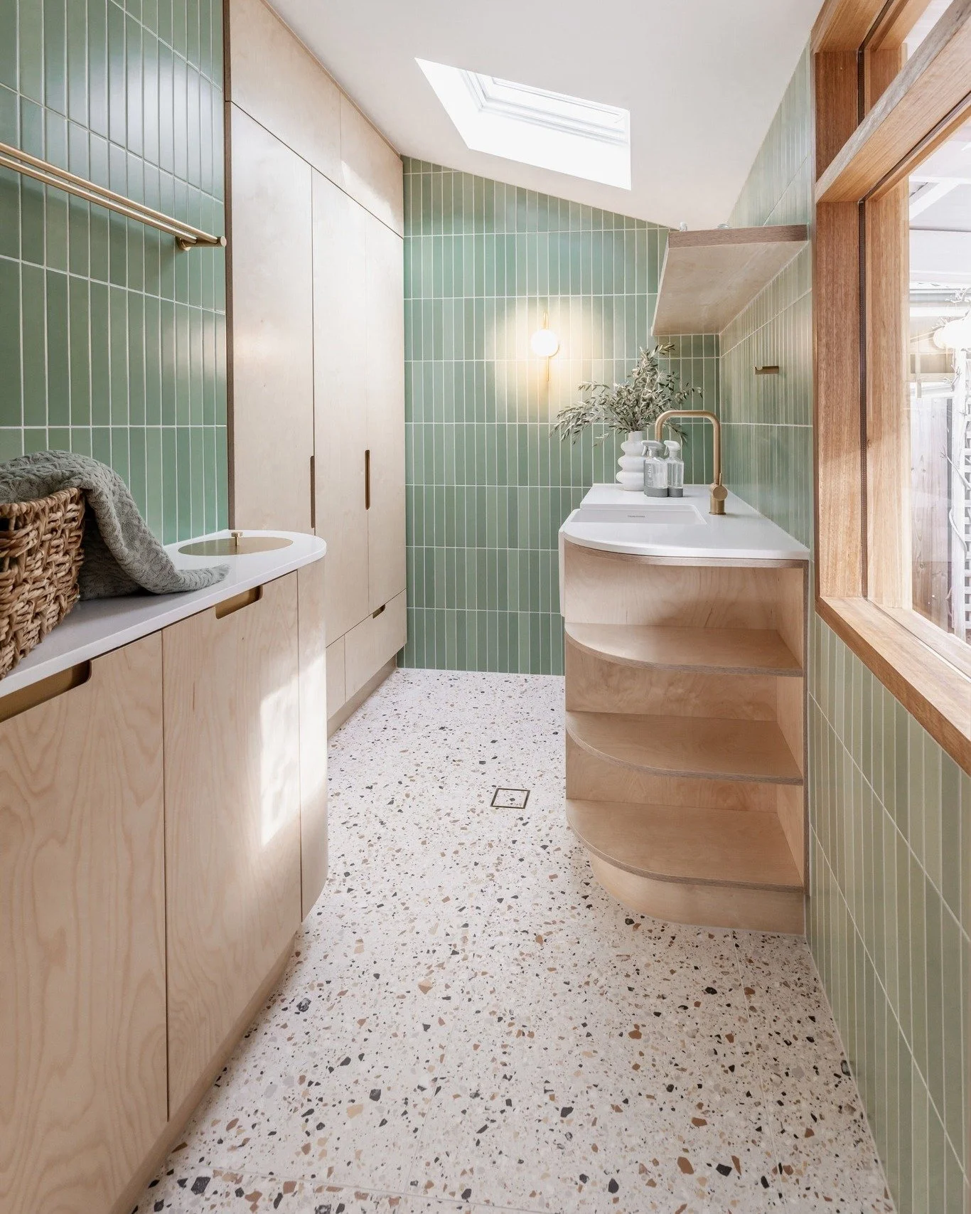 𝗙𝗿𝗲𝘀𝗵 𝘁𝗼𝗻𝗲𝘀, 𝗿𝗲𝗳𝗶𝗻𝗲𝗱 𝗱𝗲𝘁𝗮𝗶𝗹!
Soft green walls meet terrazzo-look floors, balanced with warm timber and brass for a space that feels calm, modern, and inviting.

Get the Look:
&bull; Wall Tiles: Sorrento Verde 50x300mm
&bull; Fl