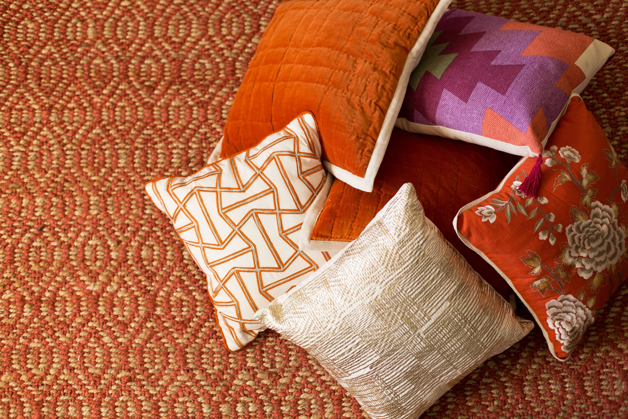 Dayka Robinson Budget Decorating pattern mix rust sisal pillows.jpg