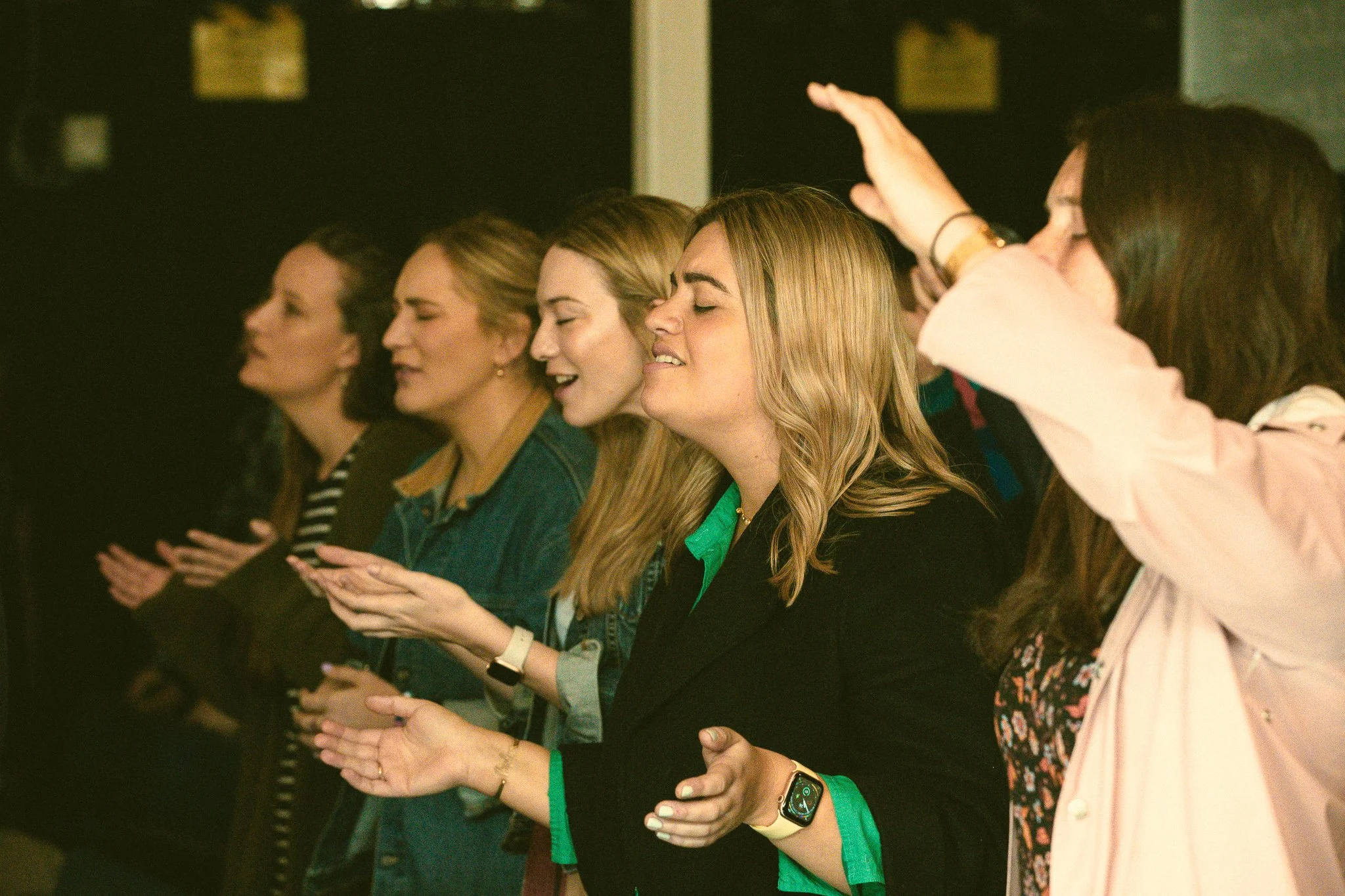 YAs in worship at Mass.jpg
