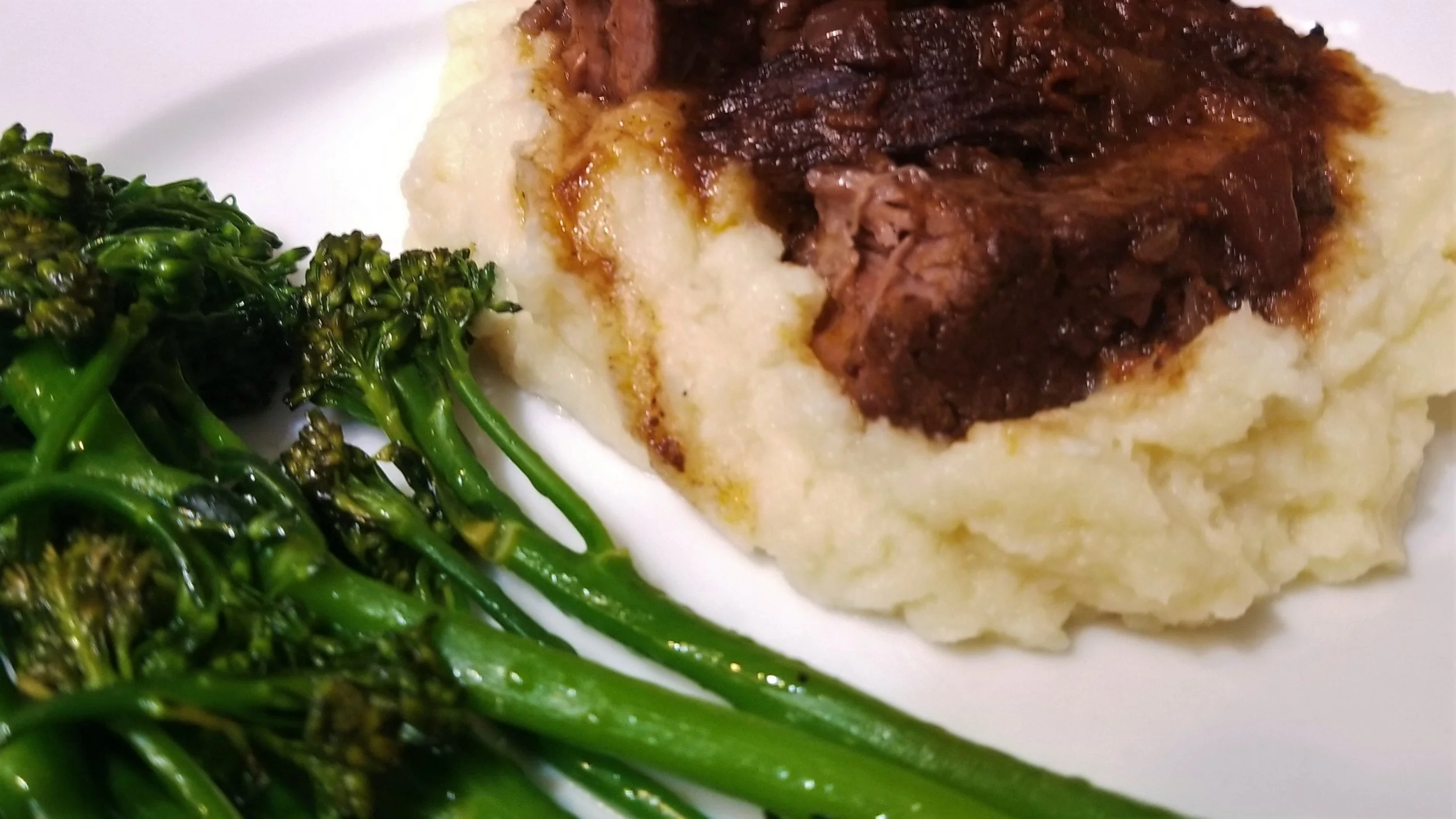 Sous vide braised short ribs, cauliflower and parsnip mash, and sauteed broccolini. 