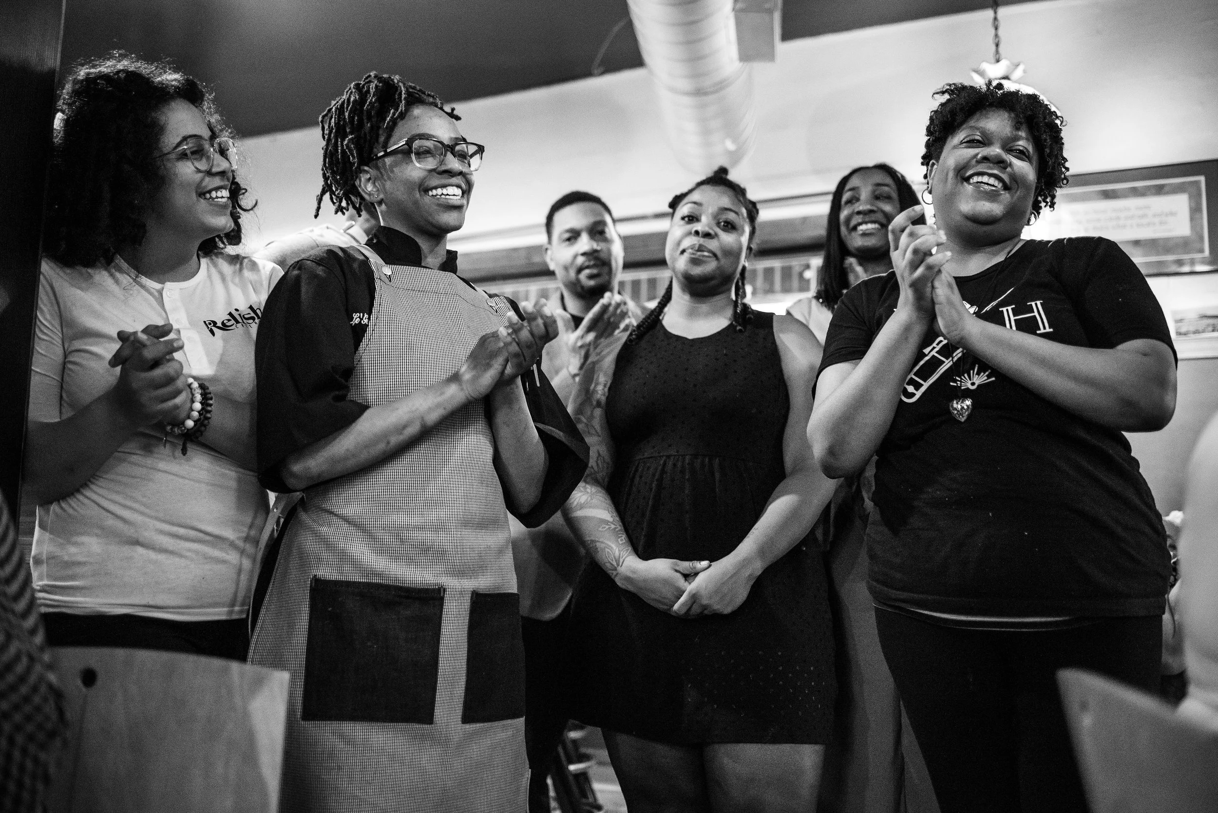 Brittiany Peeler (far left) and Le'Genevieve Squires (second from left) of Relish Catering. Viana Rickett (center) of Simple Goodness. Lauren Daniels (second from right) of Sumptuous Spirits. Ederique Goudia (far right) of Gabriel Hall.