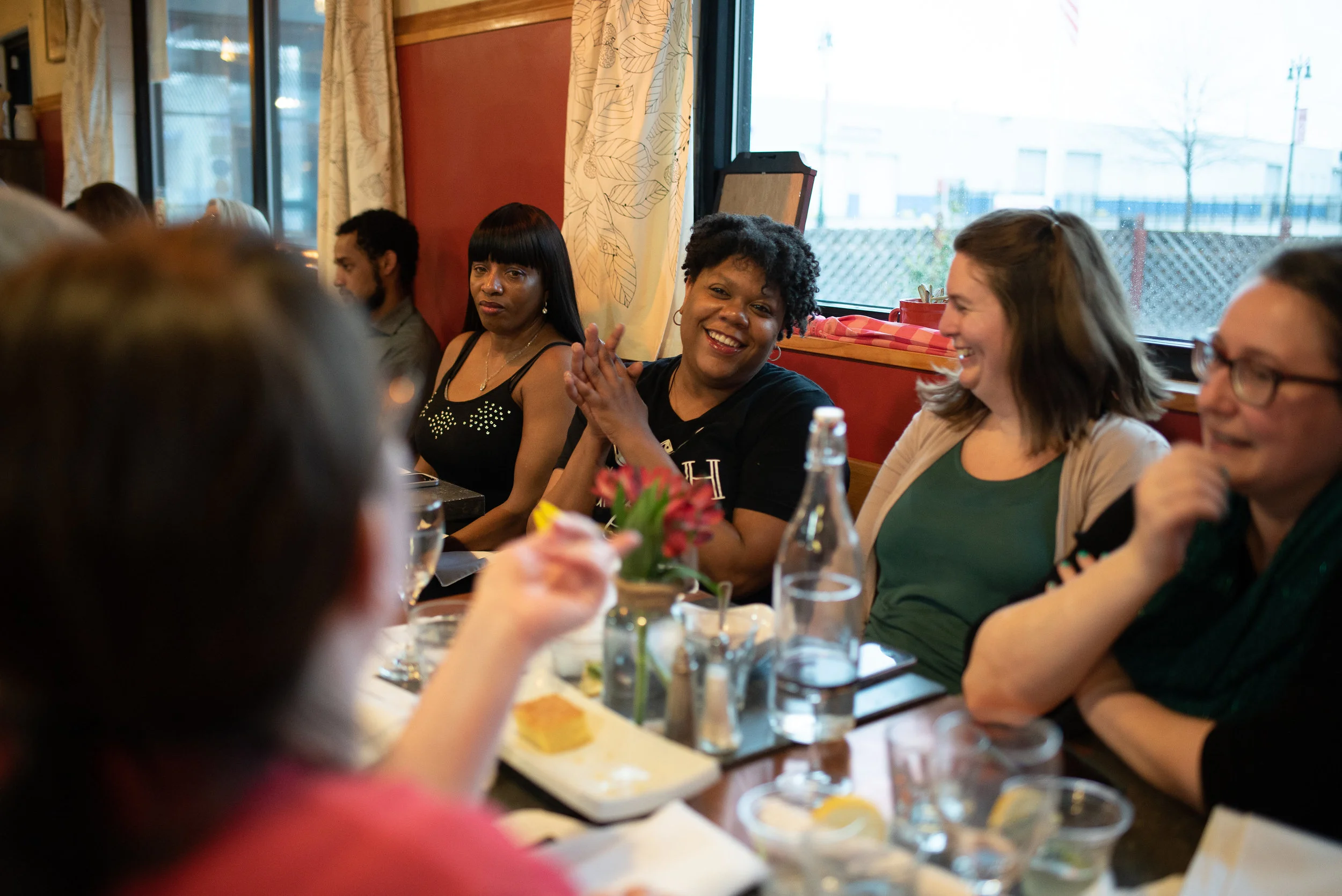 Ederique Goudia of Gabriel Hall sitting with guests.