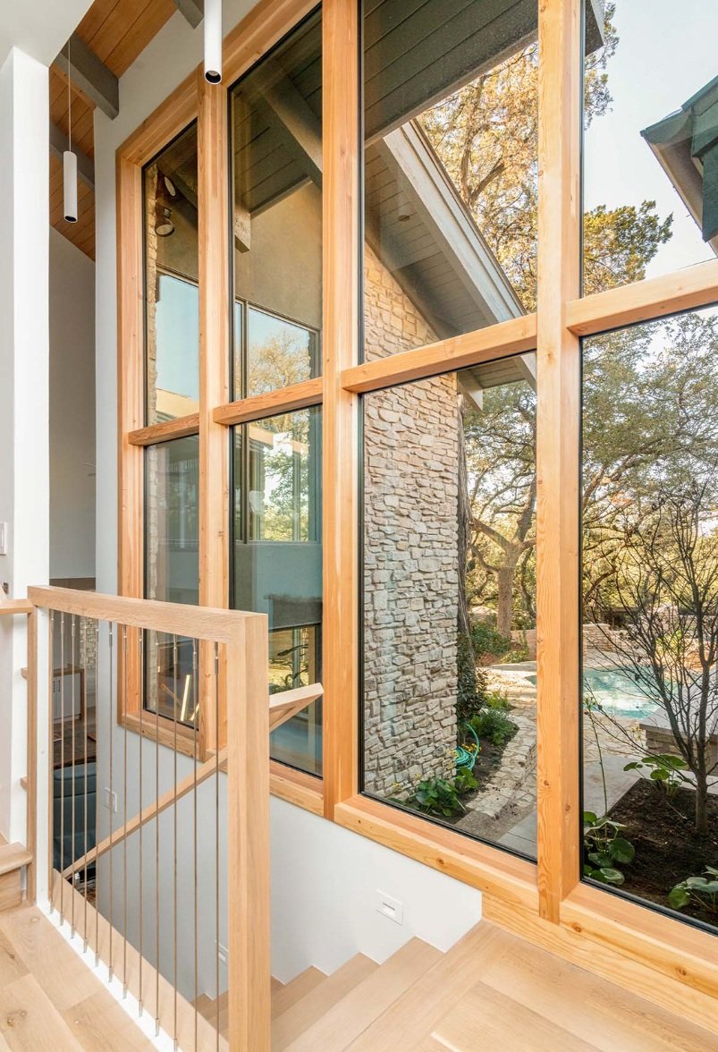 Fixed windows by Sierra Pacific in a stairwell of an Alabama home. 