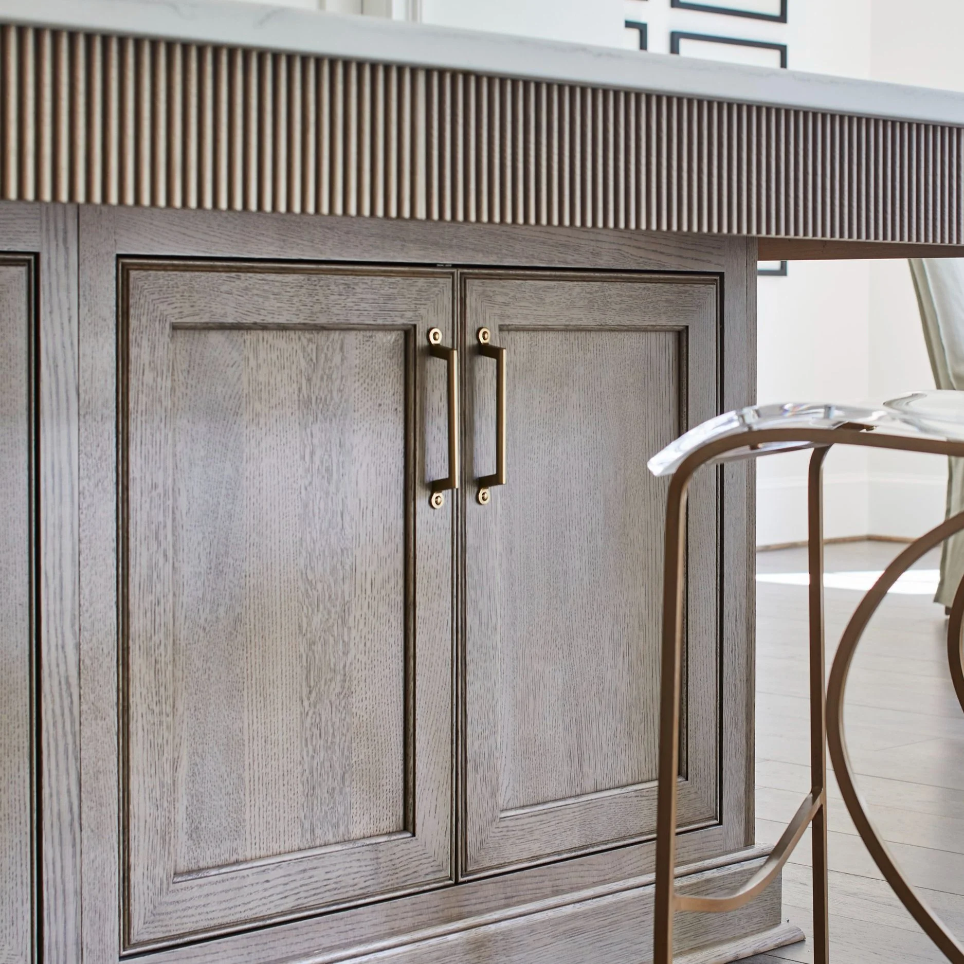 Furniture-Inspired Island with Inset Cabinet Doors and Fluted Detail