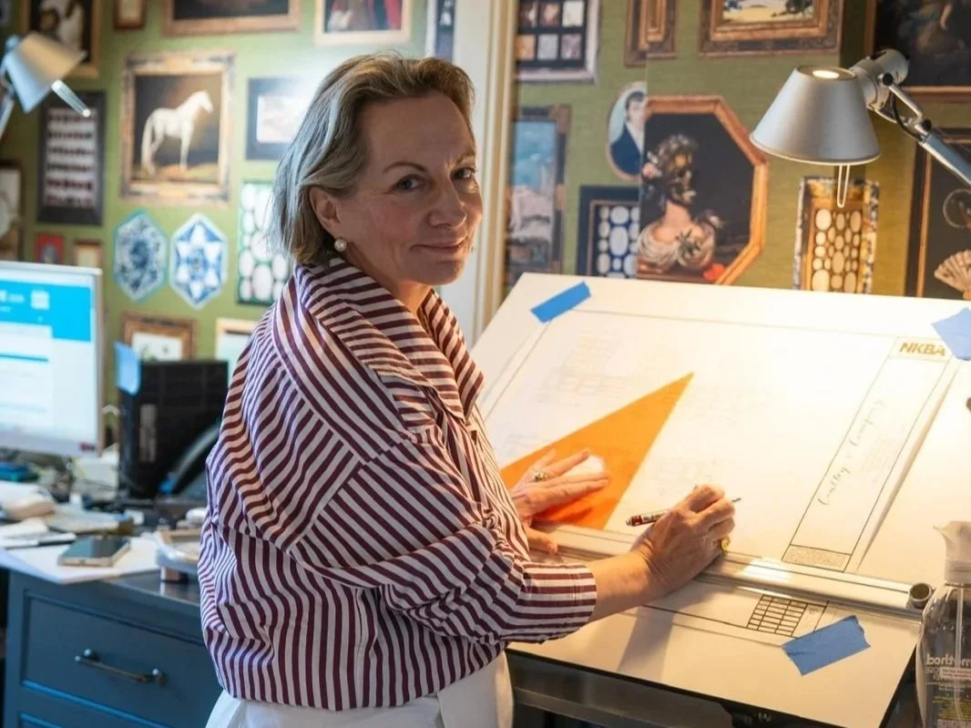 Cyndy Cantley reviewing custom cabinetry plans at her design studio in Mountain Brook, Alabama.