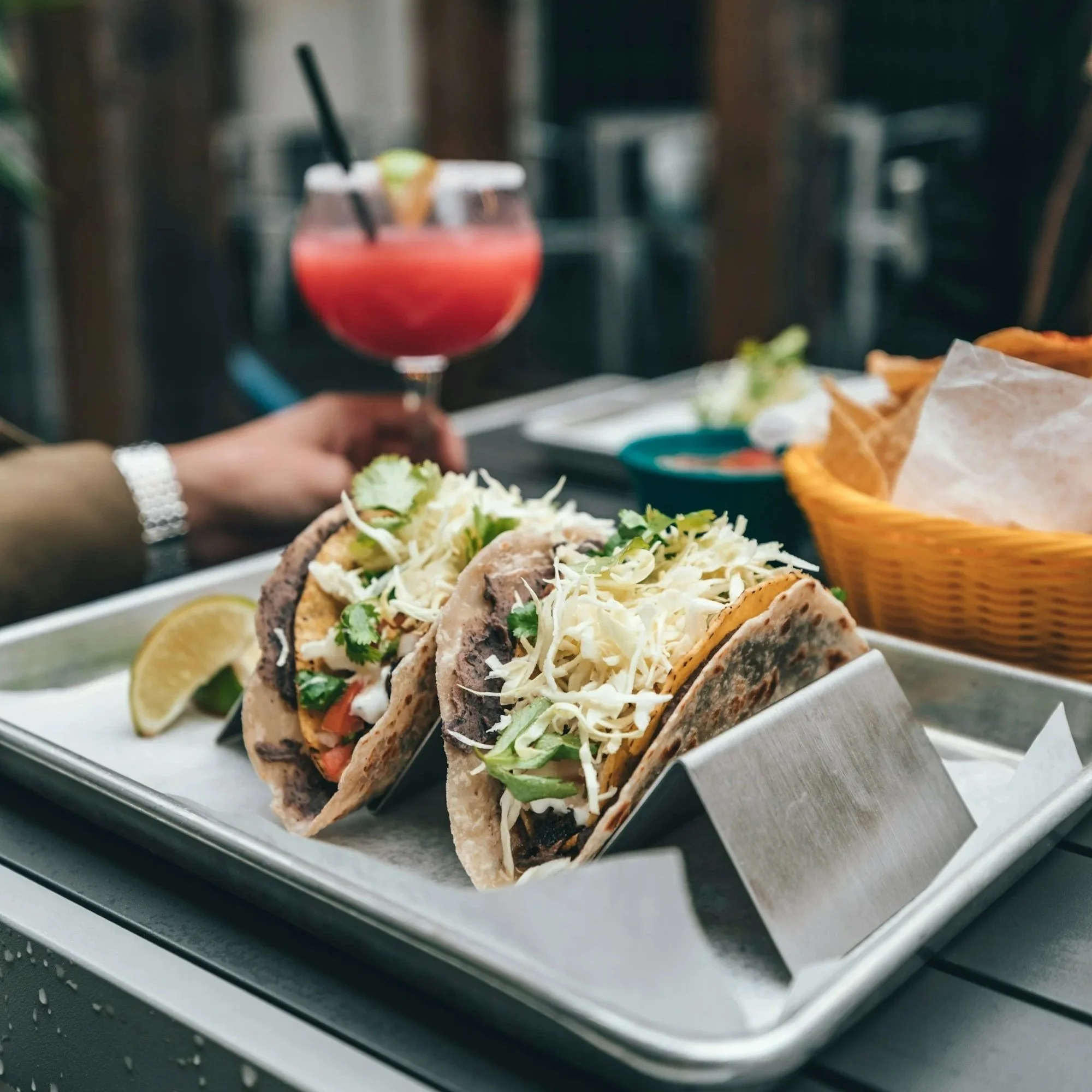 Two tacos filled with seasoned meat and fresh toppings, served as a simple, easy meal during a kitchen remodel.