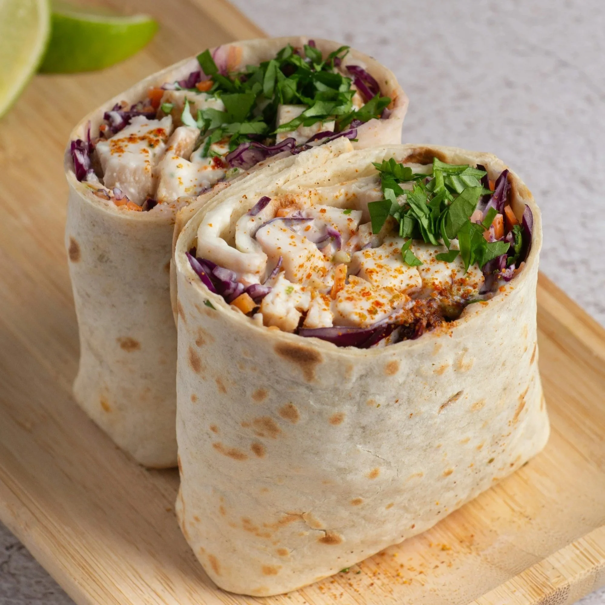 Fresh wraps filled with sliced meats, vegetables, and greens, an easy no-cook meal option during a kitchen remodel.