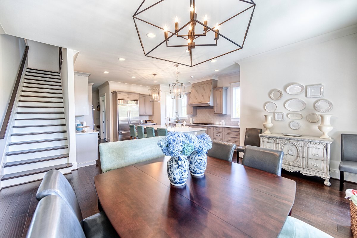 Kitchen and dining room connected by an open layout after wall removal in a Tuscaloosa home.
