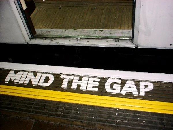 Photo of London Underground platform that says "Mind the Gap"