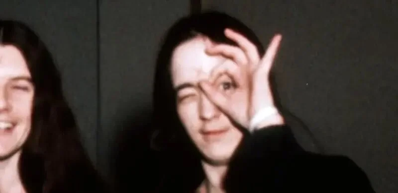 A member of the Manson Family does the one-eye sign while leaving court. Occult elite influence.