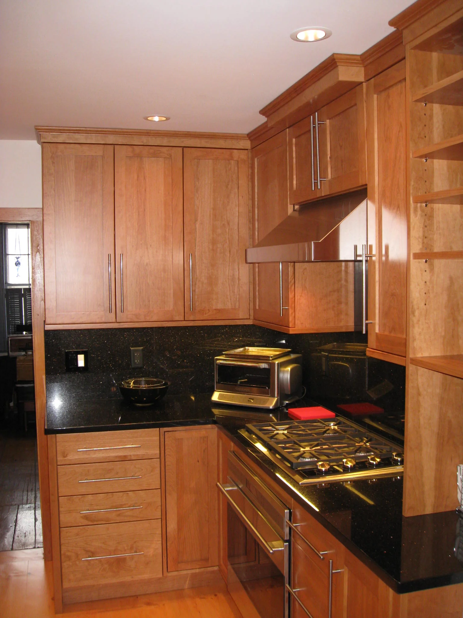 "Black Galaxy" granite and cherry cabinets provide warmth