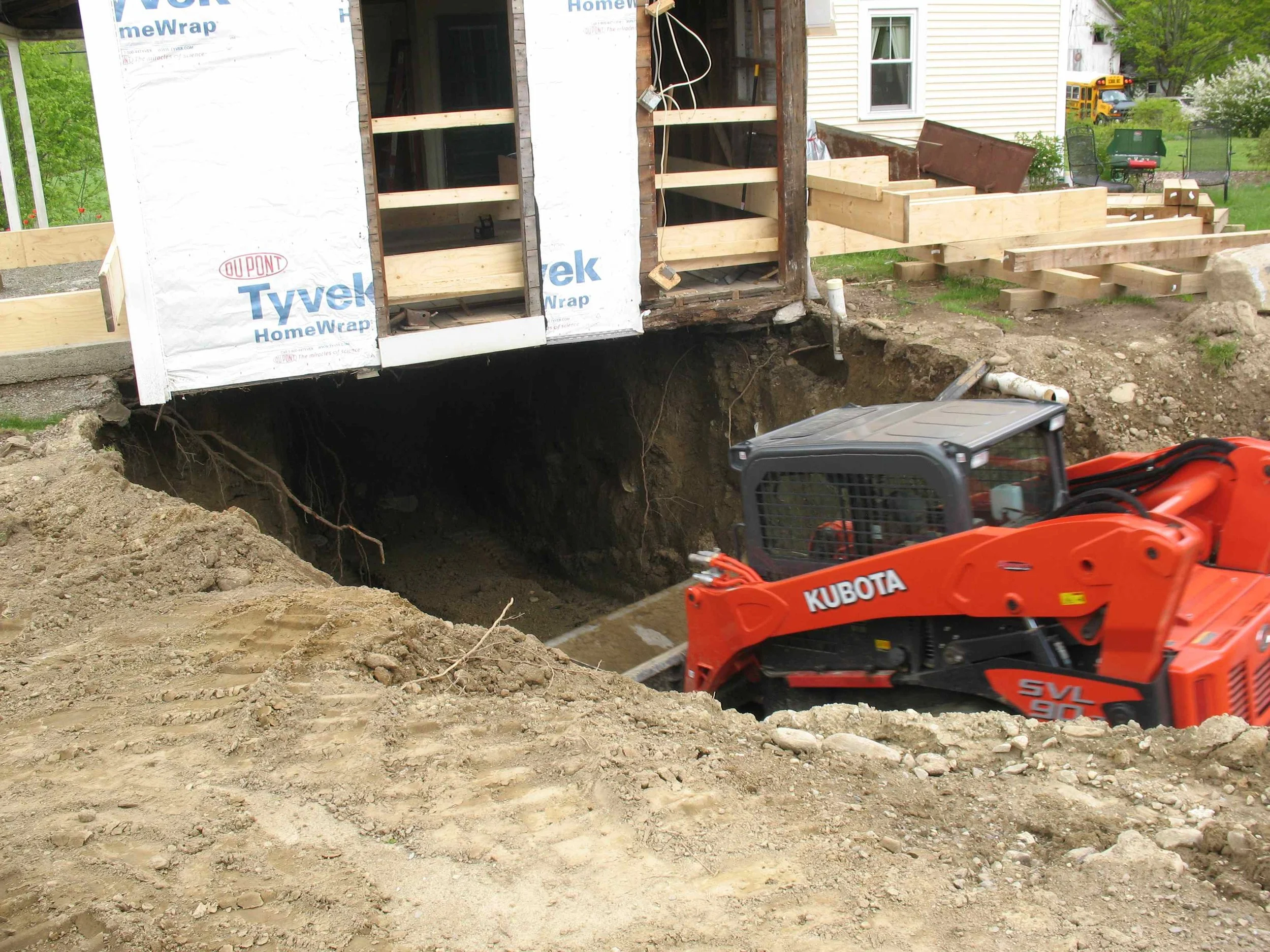 The small excavator went under the kitchen ell