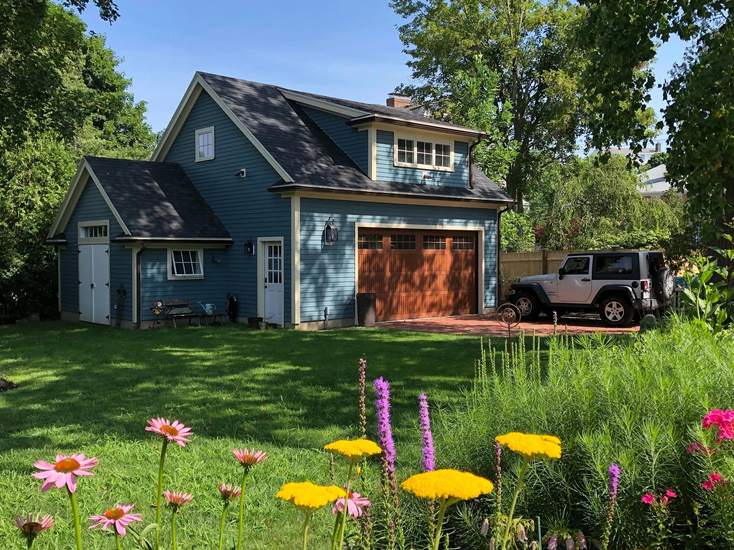   This sweet garage has an attached garden shed and a bonus room above.  