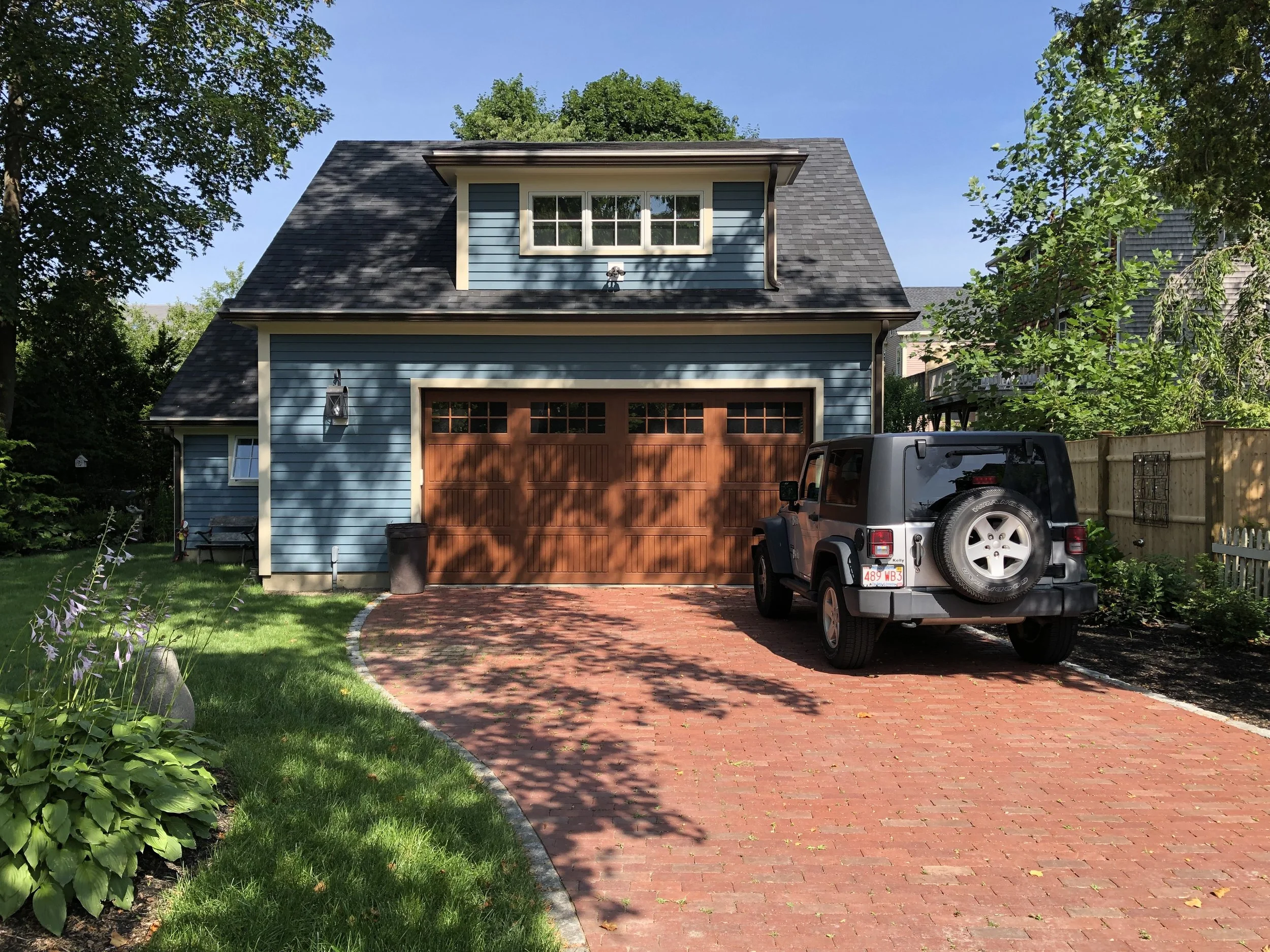   There is a pleasant brick driveway for added parking  