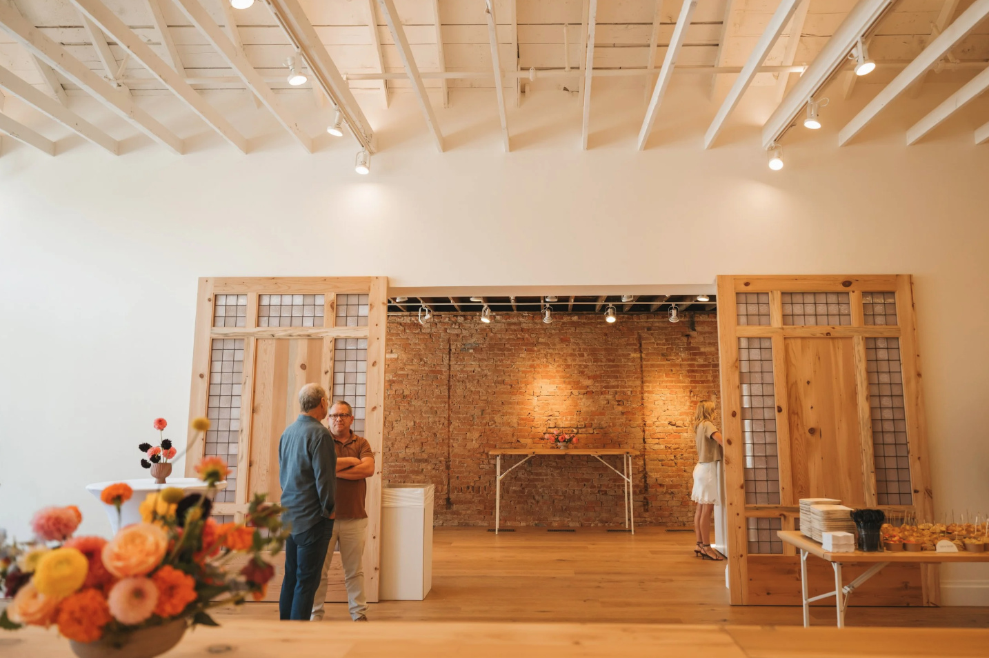 Wedding reception at The Mathis wedding venue in downtown St. George, Utah with historic brick walls and modern event space.