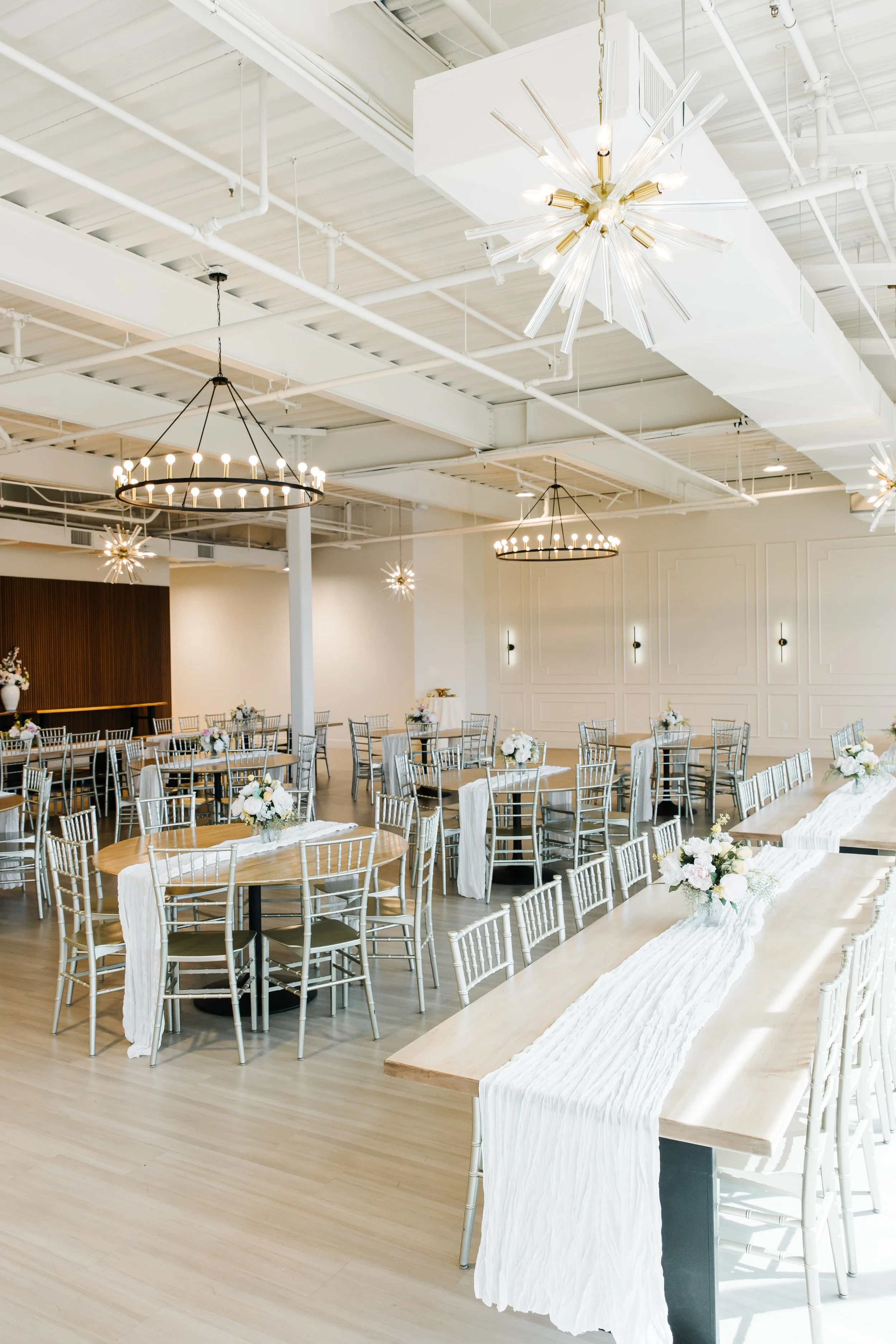 Wedding reception at The Aster Wedding & Event Venue in Washington, Utah with elegant modern event space and natural light. - St George Utah Wedding Invitations