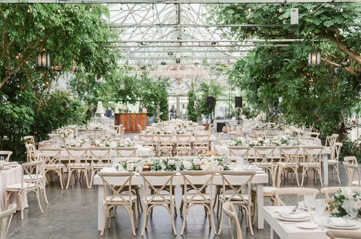 Wedding ceremony at La Caille wedding venue in Sandy, Utah featuring vineyards, gardens, and mountain views.