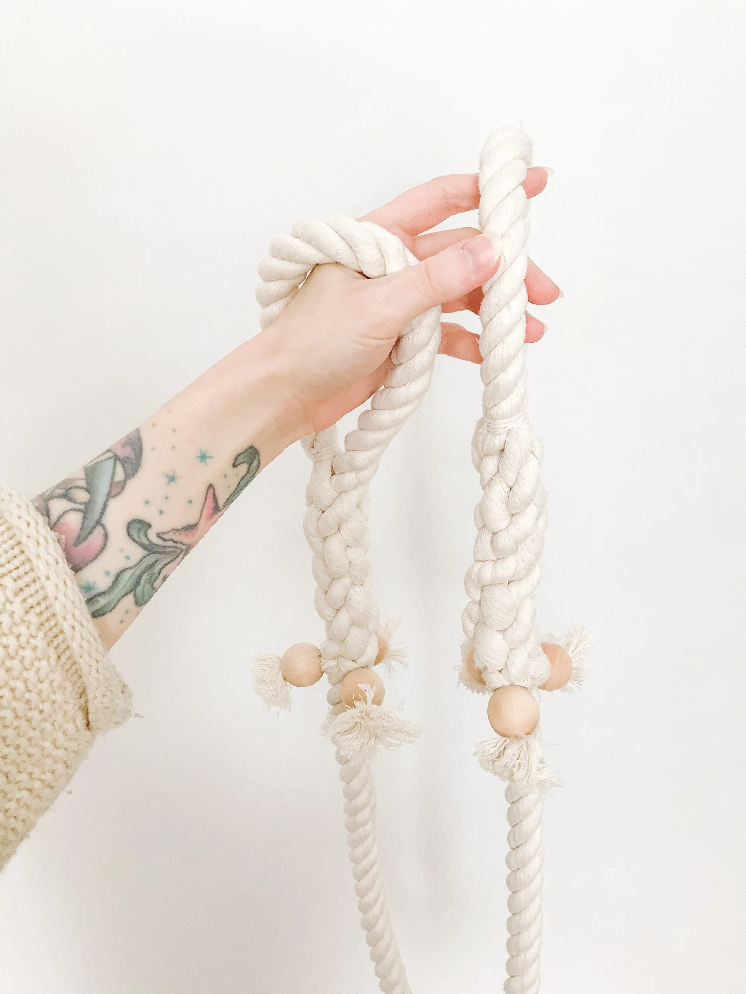 Macrame Stretch Rope being held by person.