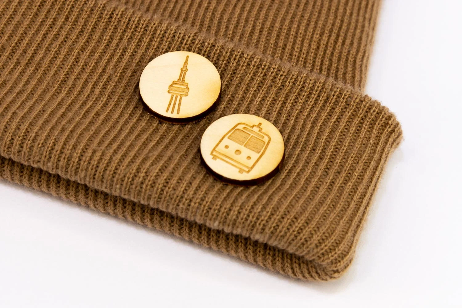 Laser engraved lapel pins on a hat