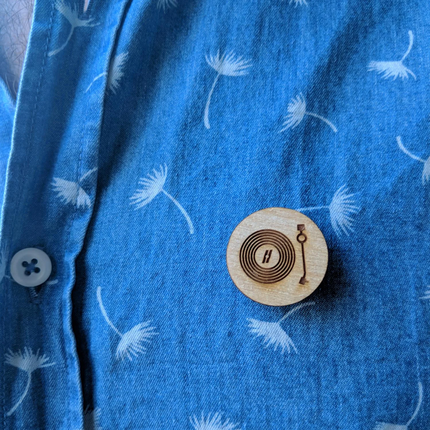 Laser engraved lapel pins on a shirt