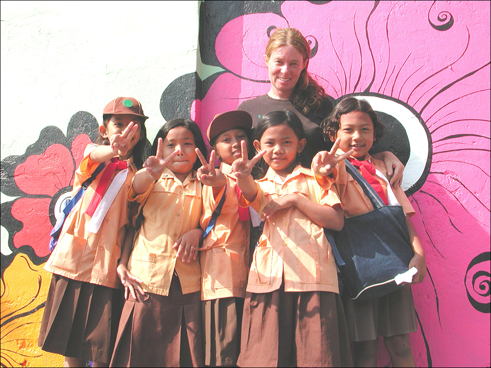 Megan----with-girls-in-front-of-pink-flower.jpg