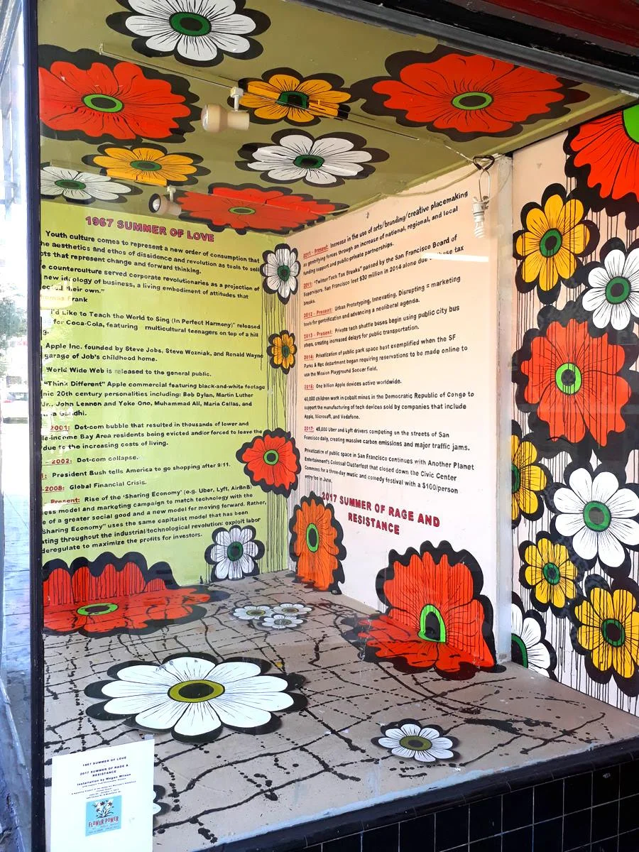 Megan Wilson, 1967 Summer of Love -> 2017 Summer of Rage & Resistance, ATA window installation, part of Wilson’s Flower Interruption project at the Asian Art Museum, 2017
