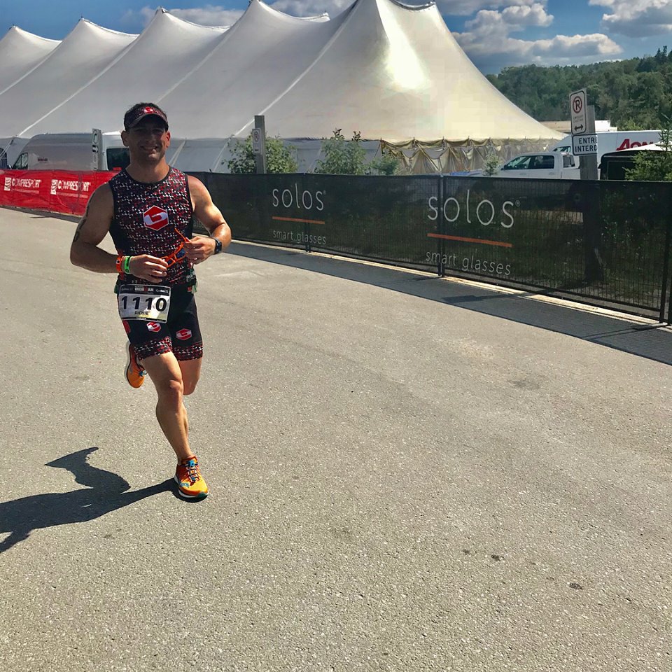 Coach_Terry_Wilson_Pursuit_of_The_Perfect_Race_IRONMAN_Mont_Tremblant_Richie_Szeliga_Smiling_Run.jpg