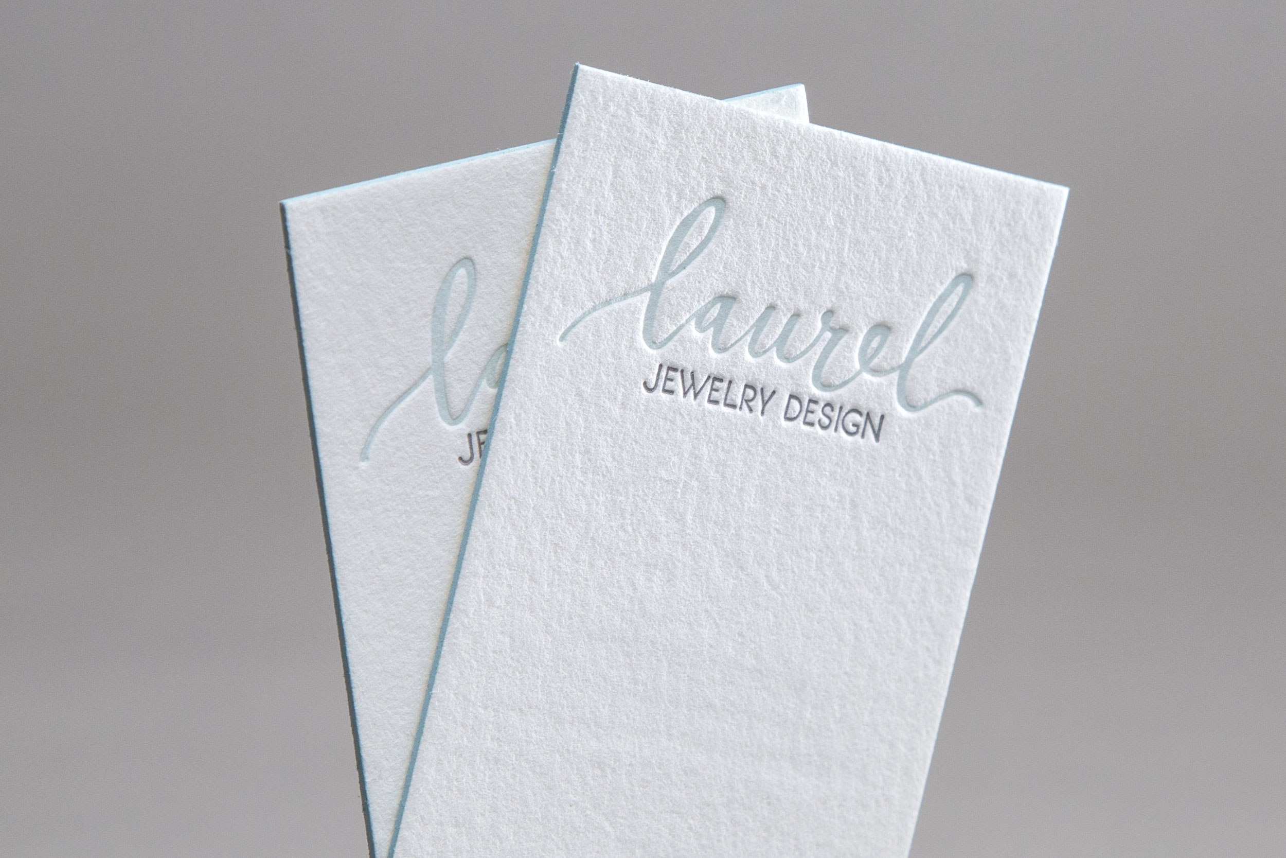 Letterpress business cards with edge printing created by hand for Laurel Jewelry Design.