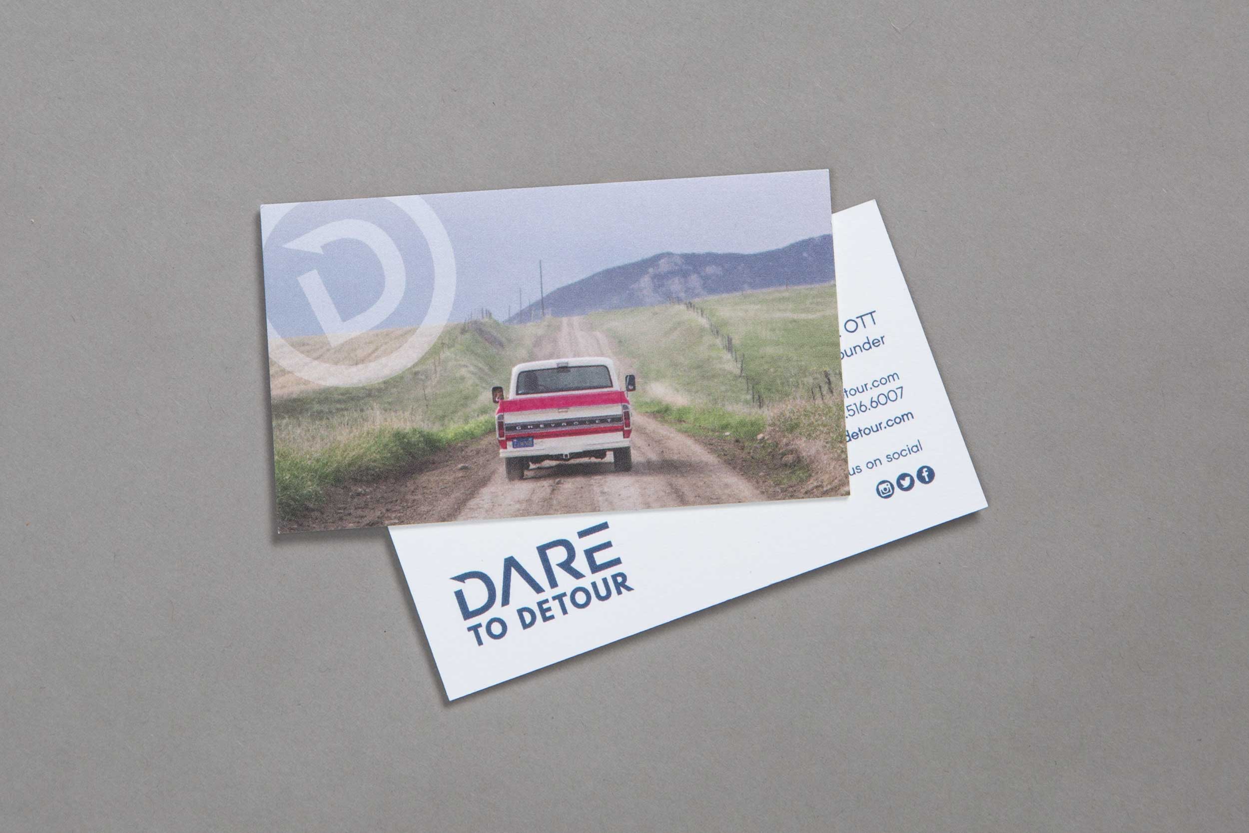 Business cards that represent Dare to Detour identity.