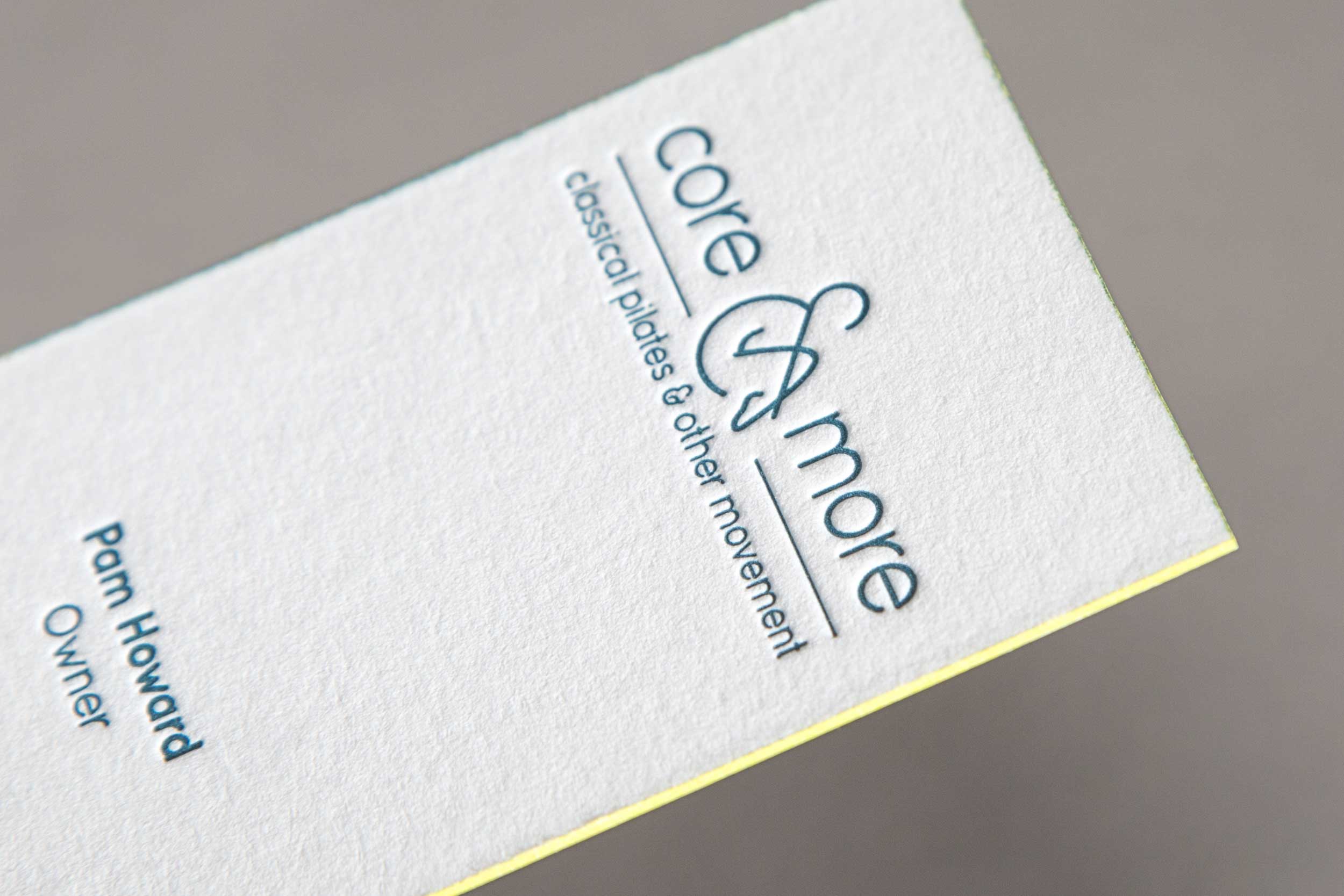 A close up of the Core and More business card to show the edge printing.